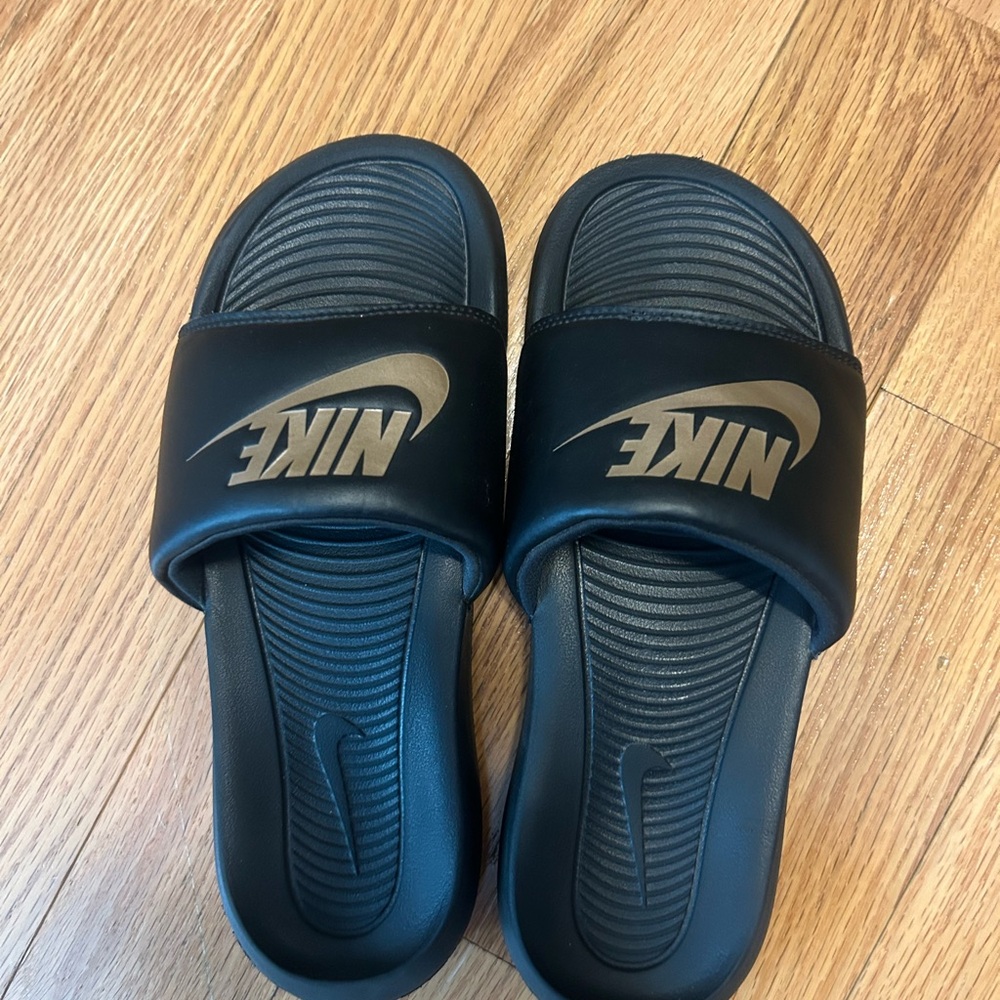 Nike Black and Gold Slides